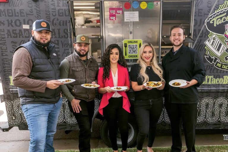 Abogada ALexandra, Jonathan and customers holding Tacos in front of the food truck -Tacos y Tequila
